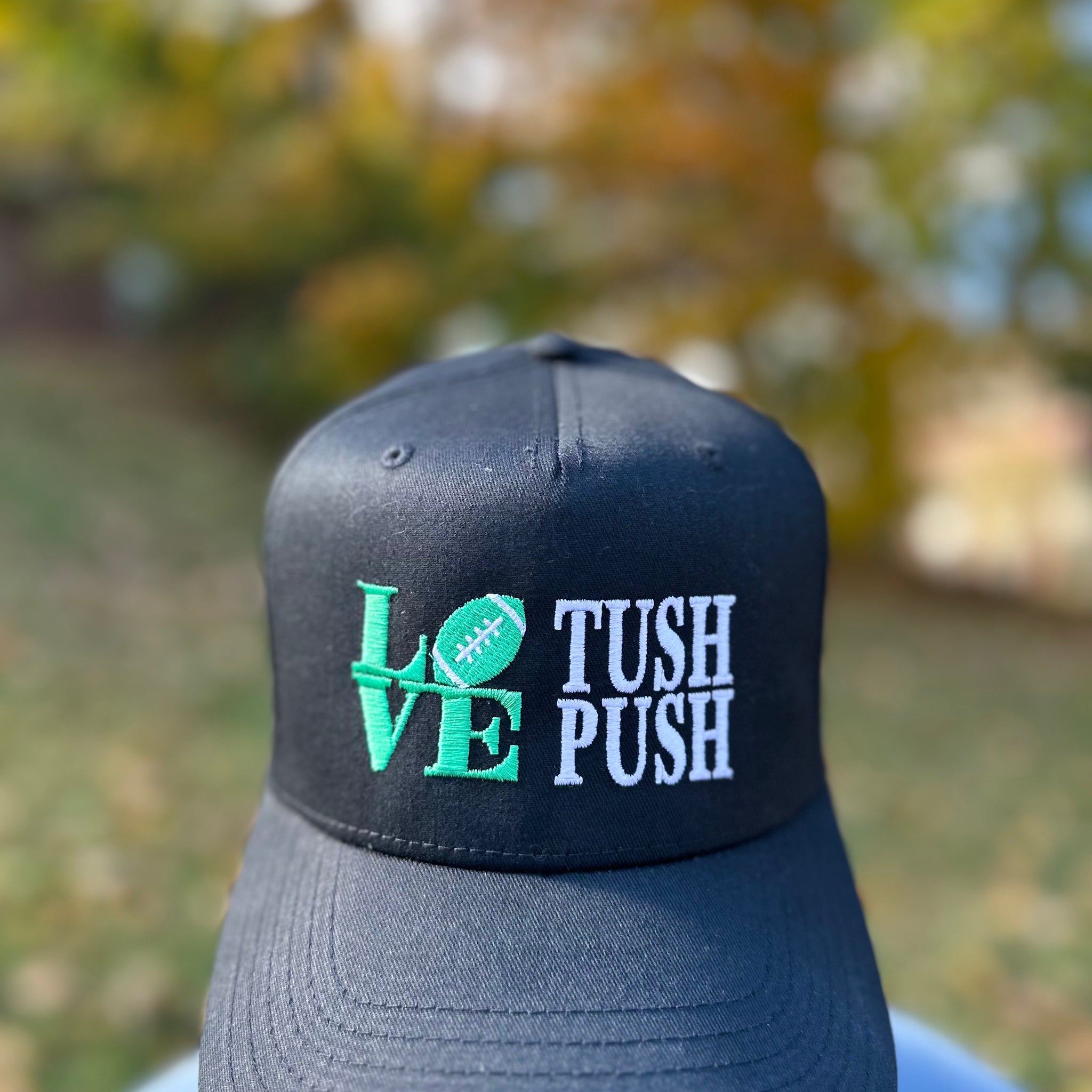 Love Tush Push Black Trucker Hat